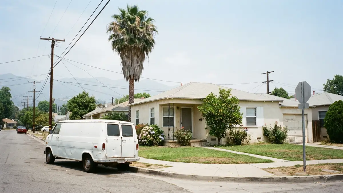 Stucco bungalow with a service van outside, booked for tankless water heater repair in Paramount, CA